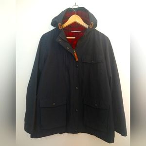 Woolrich navy blue lined raincoat.